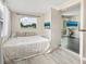 Bright bedroom featuring natural light, wood style flooring, and neutral decor at 2416 Emory Ave, Bradenton, FL 34207
