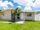 Charming front porch with seating and a freshly painted front door at 2416 Emory Ave, Bradenton, FL 34207