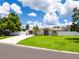 Charming home featuring a well-manicured lawn and a white picket fence at 2416 Emory Ave, Bradenton, FL 34207