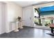 Bright and airy room featuring a tv, an exterior door and a picturesque view at 2416 Emory Ave, Bradenton, FL 34207