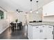 Open concept living space featuring modern lighting and dining area adjacent to the kitchen at 2416 Emory Ave, Bradenton, FL 34207
