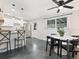 Bright living space features modern lighting fixtures and an adjacent door that leads outside at 2416 Emory Ave, Bradenton, FL 34207