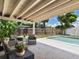 Outdoor patio with a seating area, a well-manicured yard, and a pristine swimming pool at 2416 Emory Ave, Bradenton, FL 34207