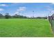 A well-maintained baseball field with green grass under a blue sky, ready for play at 245 Cape Harbour Loop # 103, Bradenton, FL 34212