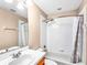 Bright bathroom with a white tiled shower over tub, modern fixtures, and neutral decor at 245 Cape Harbour Loop # 103, Bradenton, FL 34212