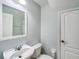 Cozy bathroom with tiled flooring, updated vanity, toilet, and framed mirror at 245 Cape Harbour Loop # 103, Bradenton, FL 34212