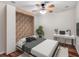 Modern bedroom with a murphy bed, clean lines, a work desk, and a large plant at 245 Cape Harbour Loop # 103, Bradenton, FL 34212