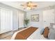 Cozy bedroom with neutral tones, wood floors, and a comfortable bed with decorative pillows at 245 Cape Harbour Loop # 103, Bradenton, FL 34212