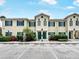 Charming multi-Gathering unit with green shutters, manicured landscaping, and ample parking spaces at 245 Cape Harbour Loop # 103, Bradenton, FL 34212