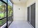 This patio features a screened-in enclosure and a sliding glass door at 245 Cape Harbour Loop # 103, Bradenton, FL 34212