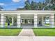 A shaded picnic area with a white roof and green tables looks out over a grassy lawn at 245 Cape Harbour Loop # 103, Bradenton, FL 34212