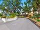 Well-maintained Orchid Oaks entrance surrounded by mature landscaping at 2748 Orchid Oaks Dr # 202, Sarasota, FL 34239