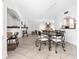 Bright dining room with black metal table and chairs that create an inviting atmosphere at 2748 Orchid Oaks Dr # 202, Sarasota, FL 34239