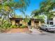 Charming single-story home with beautiful landscaping and a welcoming front porch at 2748 Orchid Oaks Dr # 202, Sarasota, FL 34239