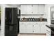 Functional kitchen with black refrigerator and ample counter space at 2748 Orchid Oaks Dr # 202, Sarasota, FL 34239