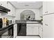 Bright kitchen featuring white cabinetry and modern fixtures at 2748 Orchid Oaks Dr # 202, Sarasota, FL 34239