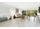 Bright living room featuring stylish furniture, decor and a sliding glass door to the balcony at 2748 Orchid Oaks Dr # 202, Sarasota, FL 34239