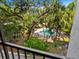 A serene pool area surrounded by lush landscaping for ultimate privacy and relaxation at 2748 Orchid Oaks Dr # 202, Sarasota, FL 34239