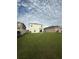 Spacious backyard with lush green grass, perfect for outdoor activities and relaxation at 2824 Rock Sound St, Bradenton, FL 34208