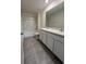 A clean bathroom featuring a double sink vanity, toilet and tub shower combination at 2824 Rock Sound St, Bradenton, FL 34208
