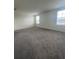 Spacious bedroom featuring plush carpet and two windows offering plenty of natural light at 2824 Rock Sound St, Bradenton, FL 34208