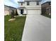 Charming two-story home with attached two car garage and well manicured lawn at 2824 Rock Sound St, Bradenton, FL 34208