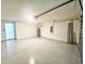 A spacious garage with epoxy flooring, overhead lighting, and garage door at 2824 Rock Sound St, Bradenton, FL 34208