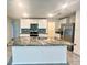 Kitchen island with granite counters, stainless appliances, and backsplash at 2824 Rock Sound St, Bradenton, FL 34208