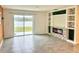 Living room featuring a fireplace, view of the lake, and tile flooring at 2824 Rock Sound St, Bradenton, FL 34208