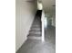 Stairs lead to the main floor showcasing carpet and tile flooring at 2824 Rock Sound St, Bradenton, FL 34208