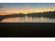 Stunning sunset over the lake with a fountain, providing a picturesque backdrop for this home at 2824 Rock Sound St, Bradenton, FL 34208