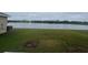 Expansive view of the lake, with a fountain feature, from the home's backyard at 2824 Rock Sound St, Bradenton, FL 34208