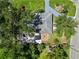 Aerial view of a home with a backyard featuring a fire pit, lounge area, and covered patio at 3011 Bougainvillea St, Sarasota, FL 34239
