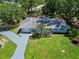 Aerial shot of a home featuring a lush lawn and mature landscaping at 3011 Bougainvillea St, Sarasota, FL 34239