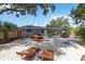 Spacious backyard with a gazebo, swing, and lounge chairs, perfect for relaxing and entertaining at 3011 Bougainvillea St, Sarasota, FL 34239