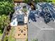Overhead view of a spacious backyard with a fire pit, lounge area, and covered patio at 3011 Bougainvillea St, Sarasota, FL 34239