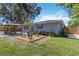 Charming backyard features a gazebo, seating area, and lush landscaping, ideal for outdoor living at 3011 Bougainvillea St, Sarasota, FL 34239