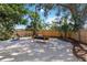 Large backyard features a swing, lush landscaping, and ample space for outdoor activities at 3011 Bougainvillea St, Sarasota, FL 34239