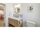 Updated bathroom features a new vanity with a marble top, gold fixtures, and a modern mirror at 3011 Bougainvillea St, Sarasota, FL 34239