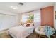 Cozy bedroom with bright natural light, warm paint, fresh carpet, and charming decor at 3011 Bougainvillea St, Sarasota, FL 34239