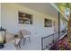 Inviting front porch with seating, stylish railings, and charming details with great curb appeal at 3011 Bougainvillea St, Sarasota, FL 34239