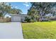 Charming single-story home with a well-maintained lawn and mature landscaping at 3011 Bougainvillea St, Sarasota, FL 34239