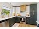 Bright kitchen featuring stainless steel appliances, modern countertops, and lots of natural light at 3011 Bougainvillea St, Sarasota, FL 34239