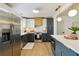 Modern kitchen featuring stainless steel appliances, an island, and stylish two-tone cabinetry at 3011 Bougainvillea St, Sarasota, FL 34239