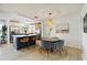 Bright, open kitchen with a center island and modern stainless steel appliances overlooking the dining area at 3011 Bougainvillea St, Sarasota, FL 34239