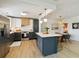 Open-concept kitchen boasts an island, stainless appliances, and seamless flow to the dining area at 3011 Bougainvillea St, Sarasota, FL 34239