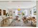 Bright living room with wicker furniture, a decorative rug, and a view of the backyard at 3011 Bougainvillea St, Sarasota, FL 34239