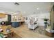 Open living area with modern decor, hardwood floors, and seamless flow to kitchen, ideal for entertaining at 3011 Bougainvillea St, Sarasota, FL 34239