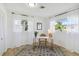 Bright office space featuring two large windows, a modern desk, and beautiful rug flooring at 3011 Bougainvillea St, Sarasota, FL 34239