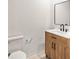Cozy half bathroom featuring new sink, vanity and commode at 3236 Kingswood Dr, Sarasota, FL 34232